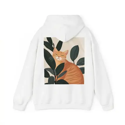 Orange Tabby Cat Among Dark Green Leaves
