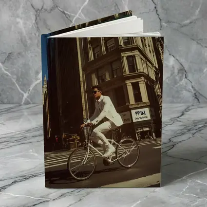 Man in White Suit Cycling New York City