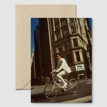 Man in White Suit Cycling New York City