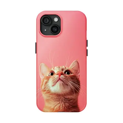 Ginger Tabby Cat Looking Up Pink Background