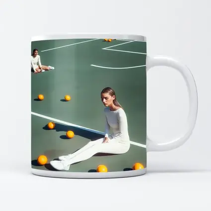 Woman Sitting On Green Tennis Court