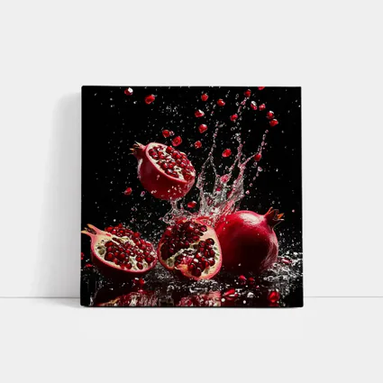 Red Pomegranates Exploding With Water Black Background