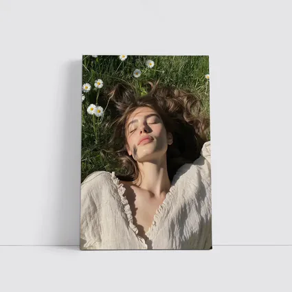 Young Woman Lying in Daisy Flower Field