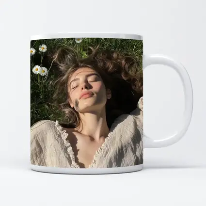 Young Woman Lying in Daisy Flower Field