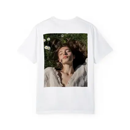 Young Woman Lying in Daisy Flower Field