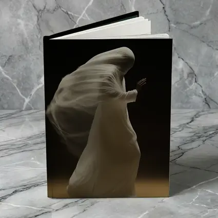 Flowing White Draped Figure Dark Background