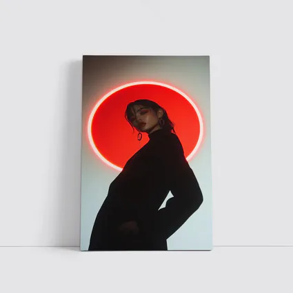 Woman in Black Against Red Neon Circle