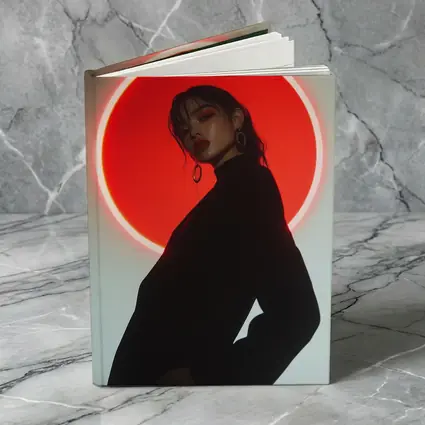 Woman in Black Against Red Neon Circle