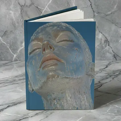 Ice Face Sculpture Against Blue Sky