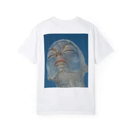 Ice Face Sculpture Against Blue Sky