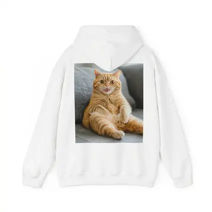 Funny Orange Tabby Cat on Gray Sofa