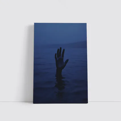 Hand Reaching From Dark Blue Ocean Water