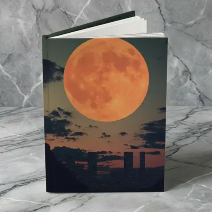 Giant Orange Moon Over City Skyline