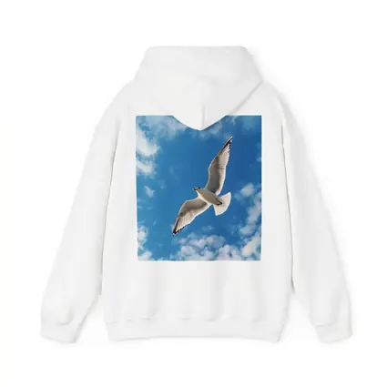 Seagull Flying Against Blue Cloudy Sky