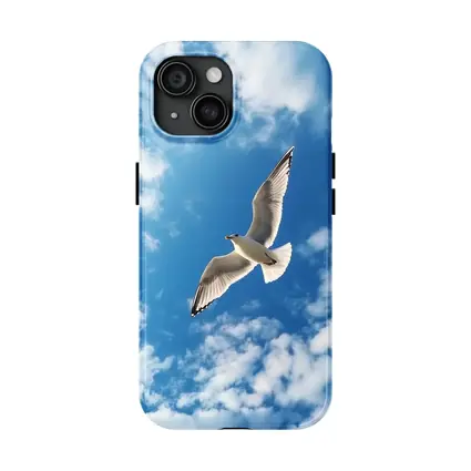 Seagull Flying Against Blue Cloudy Sky
