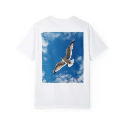 Seagull Flying Against Blue Cloudy Sky