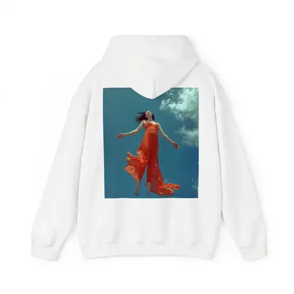 Woman Floating in Blue Sky Orange Dress
