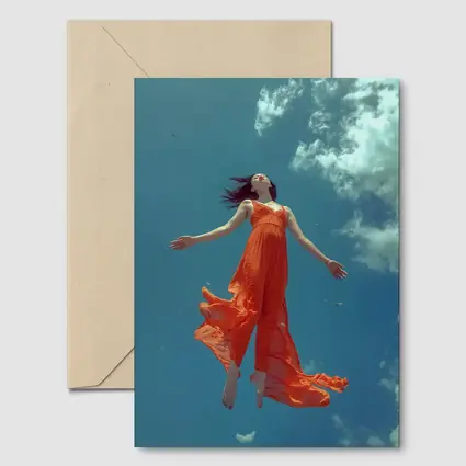 Woman Floating in Blue Sky Orange Dress