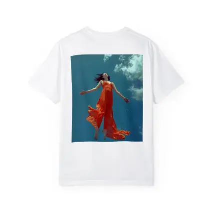 Woman Floating in Blue Sky Orange Dress