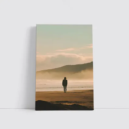 Lone Woman Standing On Misty Beach Shore