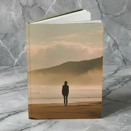 Lone Woman Standing On Misty Beach Shore