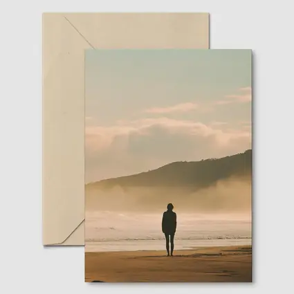 Lone Woman Standing On Misty Beach Shore