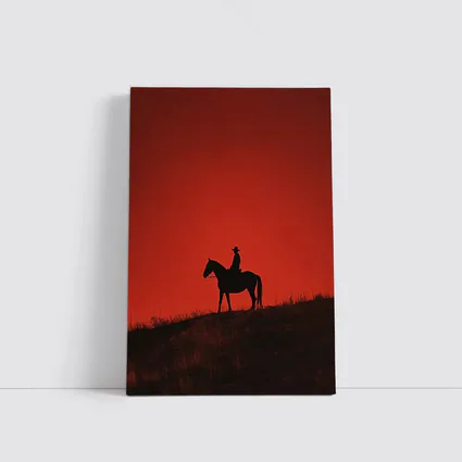 Cowboy Silhouette on Horse Red Sky