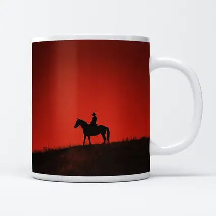 Cowboy Silhouette on Horse Red Sky