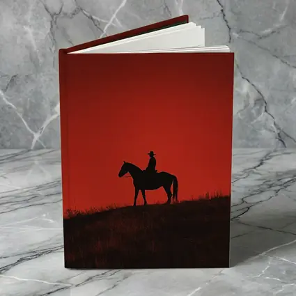 Cowboy Silhouette on Horse Red Sky