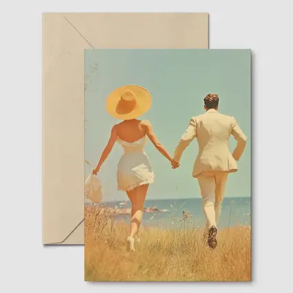Couple Holding Hands Walking Toward Ocean