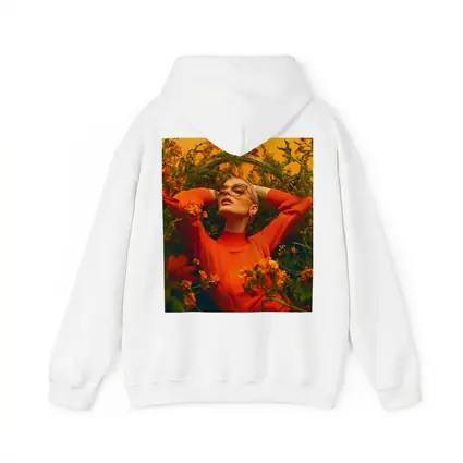 Woman in Orange Dress Among Wildflowers