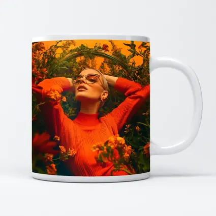Woman in Orange Dress Among Wildflowers