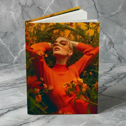 Woman in Orange Dress Among Wildflowers