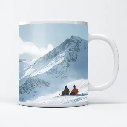 Two Skiers Resting On Snowy Mountain Peak