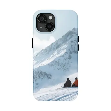 Two Skiers Resting On Snowy Mountain Peak