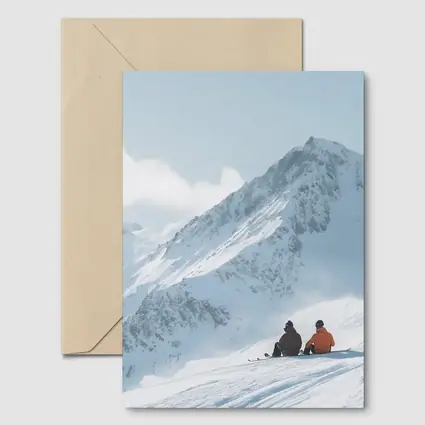 Two Skiers Resting On Snowy Mountain Peak