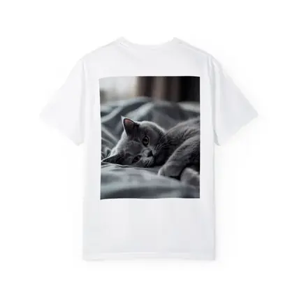 British Shorthair Cat Resting On Gray Bedding