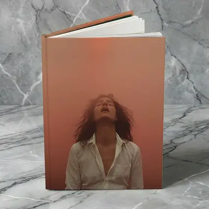Woman Head Back Warm Orange Misty Background