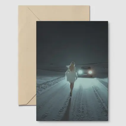 Woman Walking Snowy Road At Night