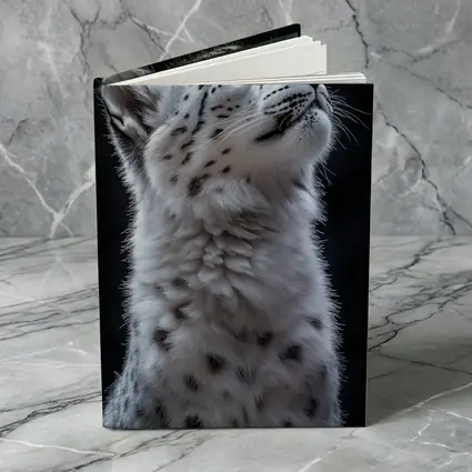 Snow Leopard Cub Looking Up Dark Background