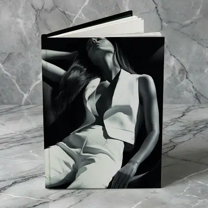 Woman in White Suit Dark Chair