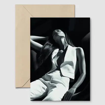 Woman in White Suit Dark Chair