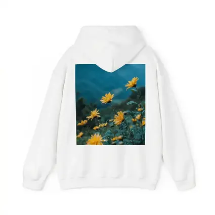 Yellow Daisies Blooming Against Misty Mountains