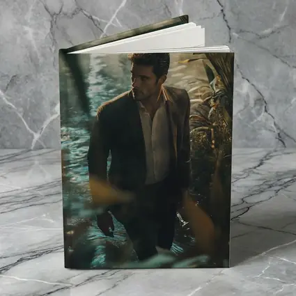 Man in Suit Wading Through Jungle Water