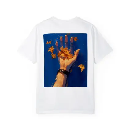 Hand Holding Autumn Leaves Over Blue Water