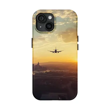 Airplane Silhouette Flying Over City Sunset