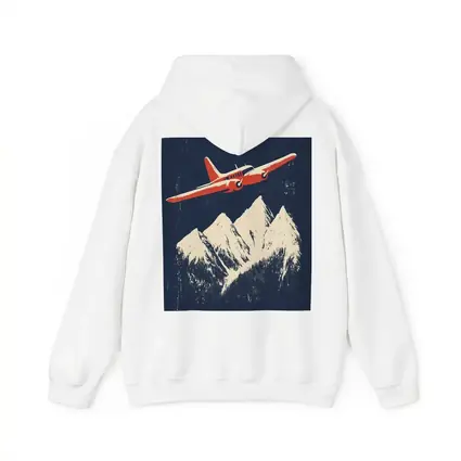 Red Vintage Plane Flying Over Snowy Mountains