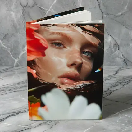Woman Face Reflected Through Water With Flowers