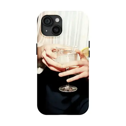 Hands Holding Cocktail Glass With Lemon