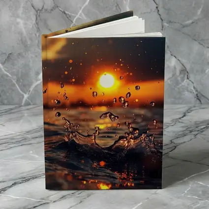 Water Splash at Golden Sunset Ocean